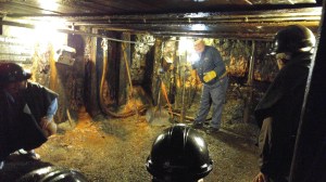 museum, mine, bending over