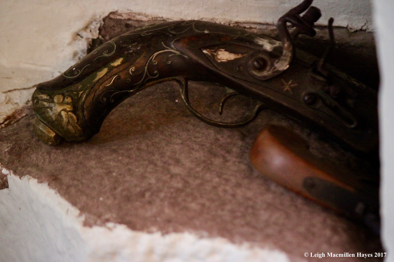 s-pistols beside the toilet